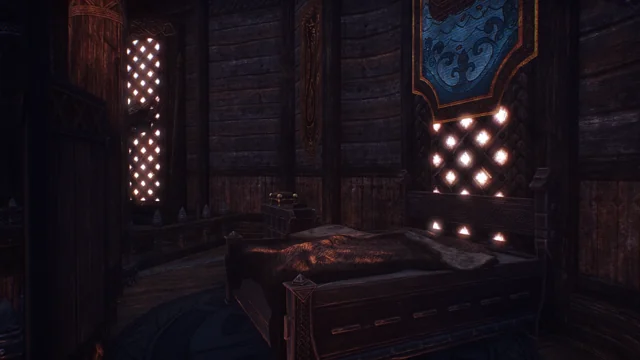 The bed under patterned windows